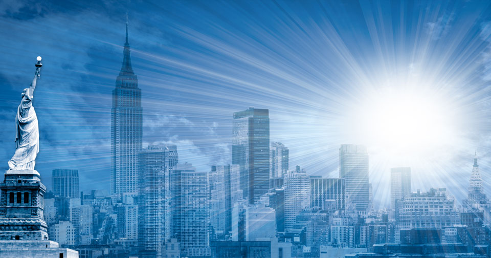 An artistic rendering of a radiant celestial body shining over a skyline featuring the Statue of Liberty and iconic skyscrapers including the Empire State Building, set against an expansive blue sky with streaming light rays.