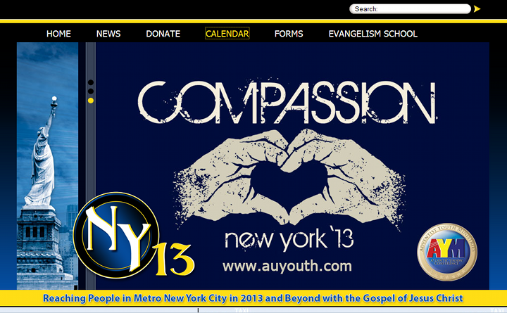 A website banner featuring a column on the left with an image of the Statue of Liberty, and a larger right section displaying the word “COMPASSION” in bold white letters. In the center, two white hands form a heart shape around a silhouette of the city’s skyline, overlaid on a navy blue night sky dotted with stars. Logos for “NY 13” and “AYM Worship Hour” are situated at the bottom left and right, respectively. Below is a banner text announcing outreach in Metro New York City in 2013 and beyond with the Gospel of Jesus Christ.
