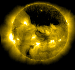 A detailed scientific image of the sun exhibiting intense solar activity, with multiple bright solar flares and magnetic storms visible.