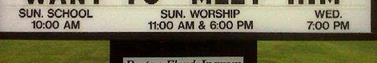 A sign at a public venue displaying schedules for Sunday school at 10:00 AM, Sunday worship services at 11:00 AM and 6:00 PM, and a Wednesday event at 7:00 PM.