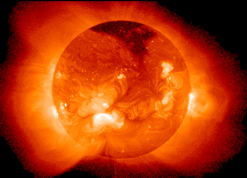 Detailed image of the Sun showcasing intense solar activity, with bright areas indicating solar flares and dark patches representing sunspots, set against a deep black backdrop.