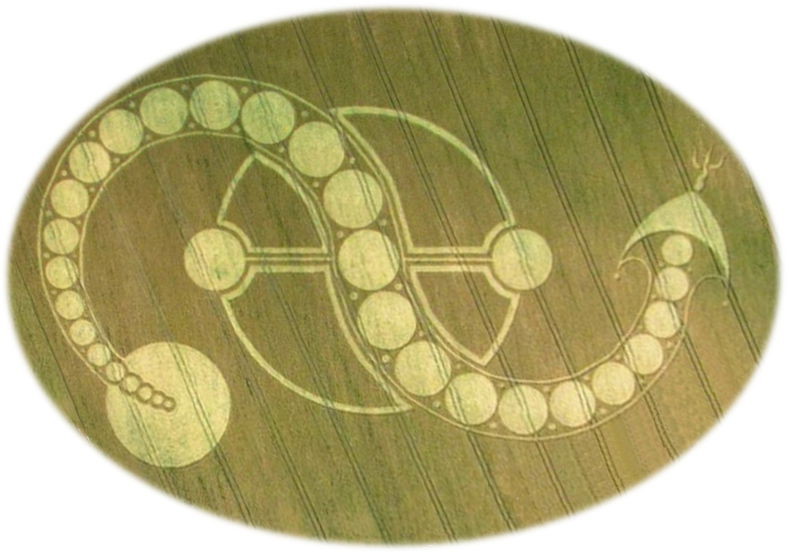 Aerial view of a circular geometric pattern in a crop field, featuring a large circle connected to a crescent shape with a chain of smaller circles, evoking astronomical or celestial themes reminiscent of the Mazzaroth.