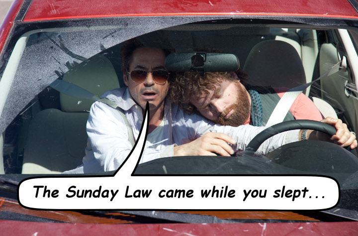 Two men in a car; one appears tired or asleep with his head leaning on the shoulder of the other, who is alert and driving. The car windshield is splattered with a substance looking like snow or frost. A speech bubble from the car's side reads "The Sunday Law came while you slept..."