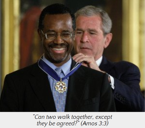 An image of two men, one is pinning a medal on the other who is smiling. The medal recipient is wearing a dark suit with a blue and white striped tie, and the other man is dressed in a darker suit and appears to be assisting with adjusting the medal. A Biblical quote from Amos 3:3, “Can two walk together, except they be agreed?” overlays the photo.