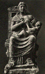 A black and white photo of an ancient statue of a woman holding scales, symbolizing justice. The figure, carved in stone, is seated on a throne with drapery details, exuding a serene and majestic aura.
